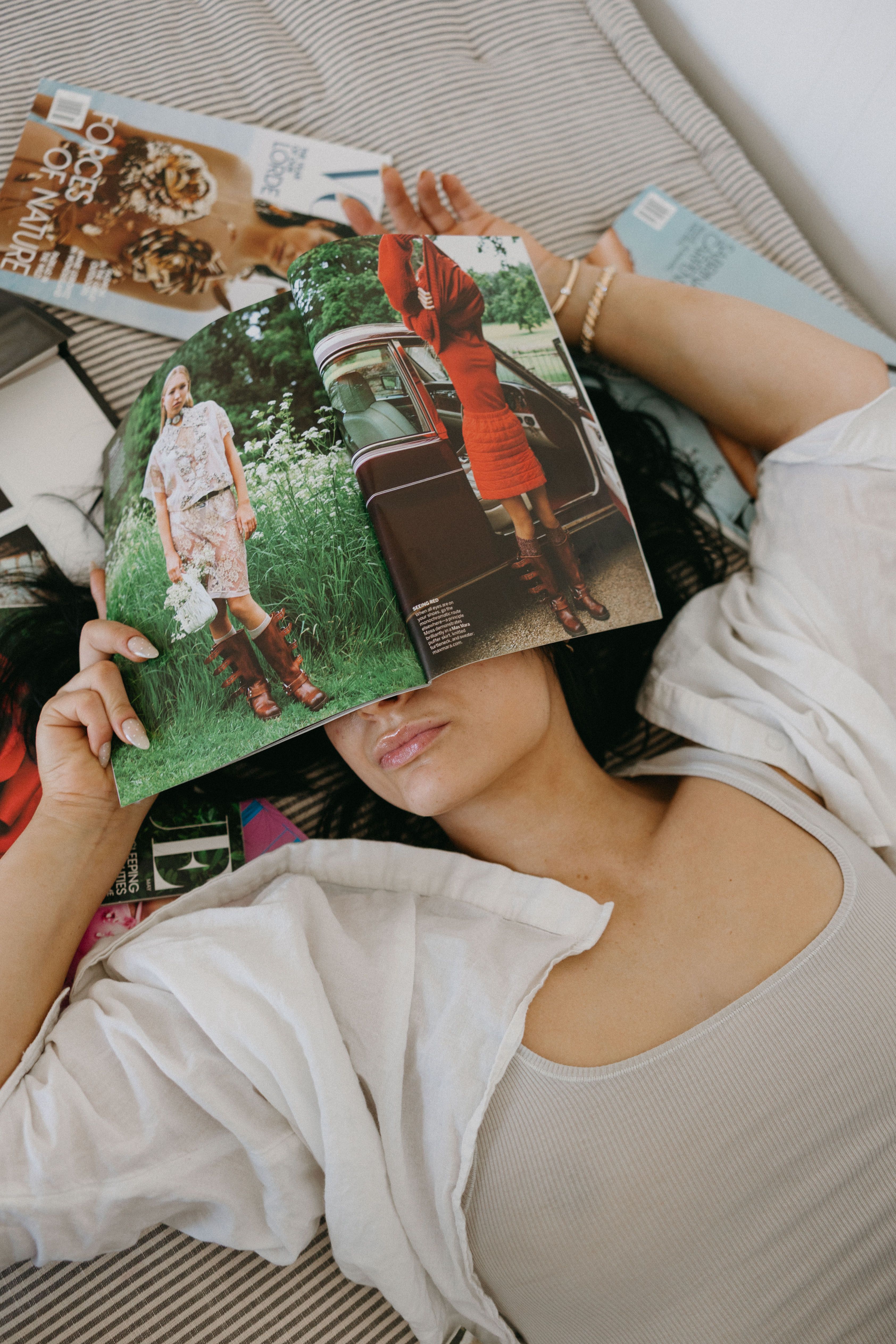 Woman Relaxing with Fashion Magazine Indoors · Free Stock Photo