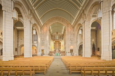 The nave of a historic cathedral in low light — photo by Michael D Beckwith on Pexels