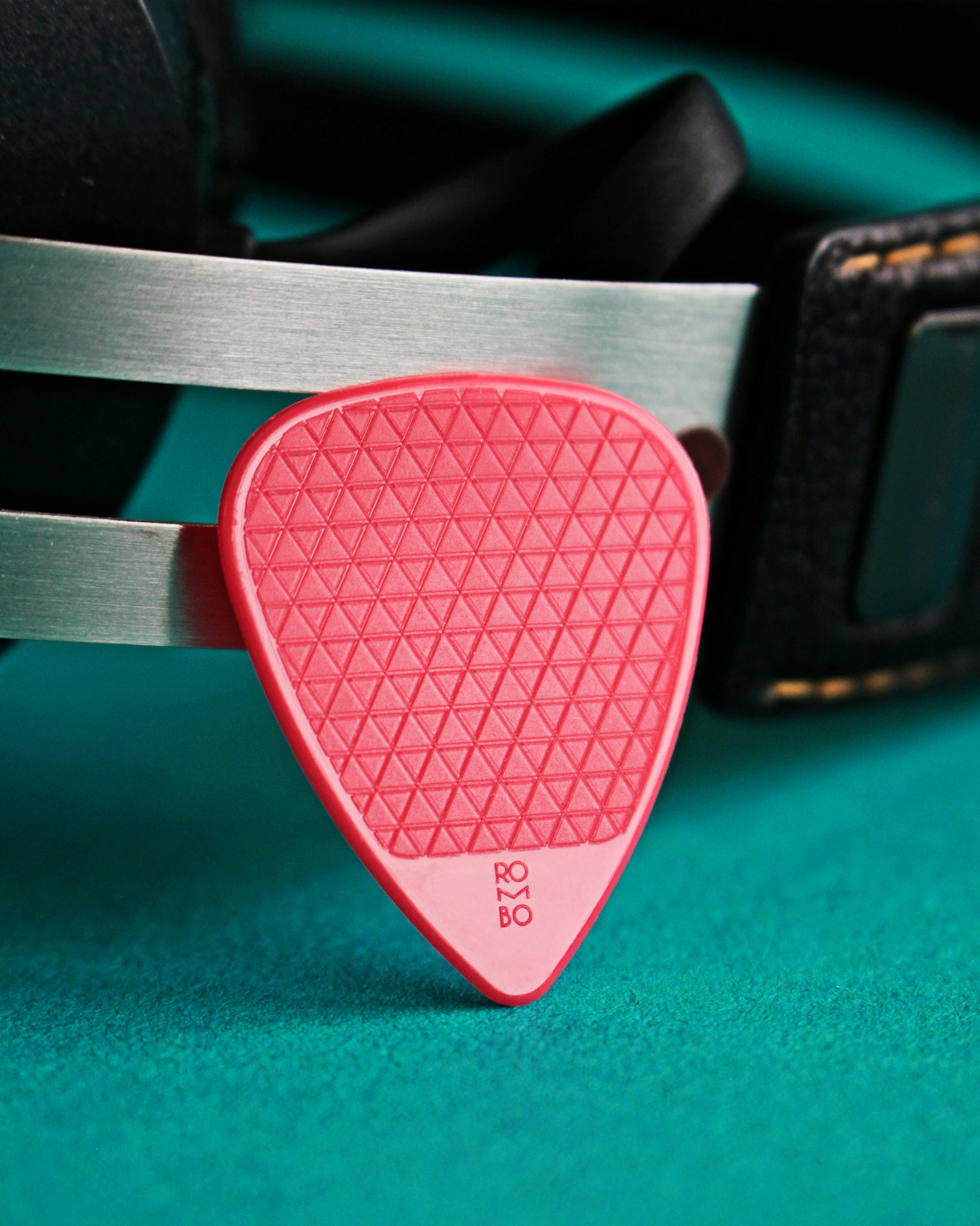 Red Guitar Pick in Close Up Photography · Free Stock Photo