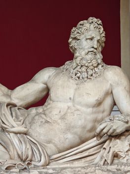 Detailed view of an ancient marble statue in the Vatican Museum, Rome.