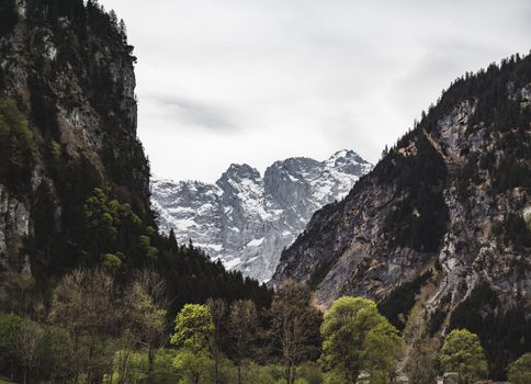 Breathtaking view of snow-capped mountain peaks in Unterschächen, Uri, Switzerland.