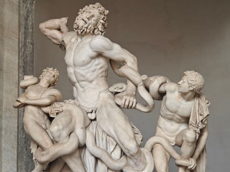 Classic sculpture of Laocoön and his sons with serpents, showcasing intricate marble artistry.