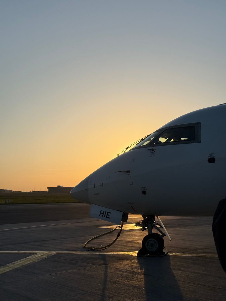 Aircraft on runway at sunrise