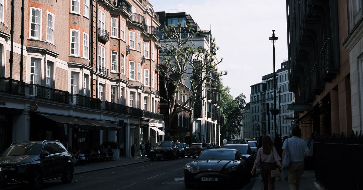 No Win No Fee Solicitors Near Me: Finding the Right Personal Injury Lawyer — Charming urban street view featuring classic architecture and pedestrians under a clear sky.