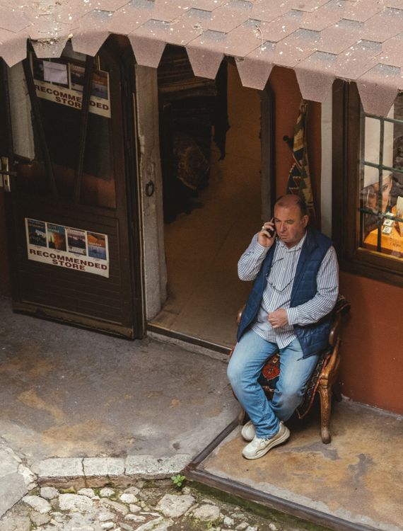 Local business owner reviewing a local SEO audit outside a shop