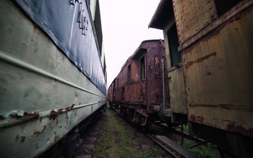 Free Rusty and weathered train carriages in Jaworzyna Śląska rail yard, Poland. Stock Photo