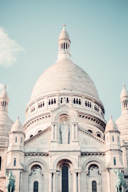 Free Elegant view of the Sacré-Cœur Basilica in Paris, showcasing intricate architectural details against a clear sky. Stock Photo