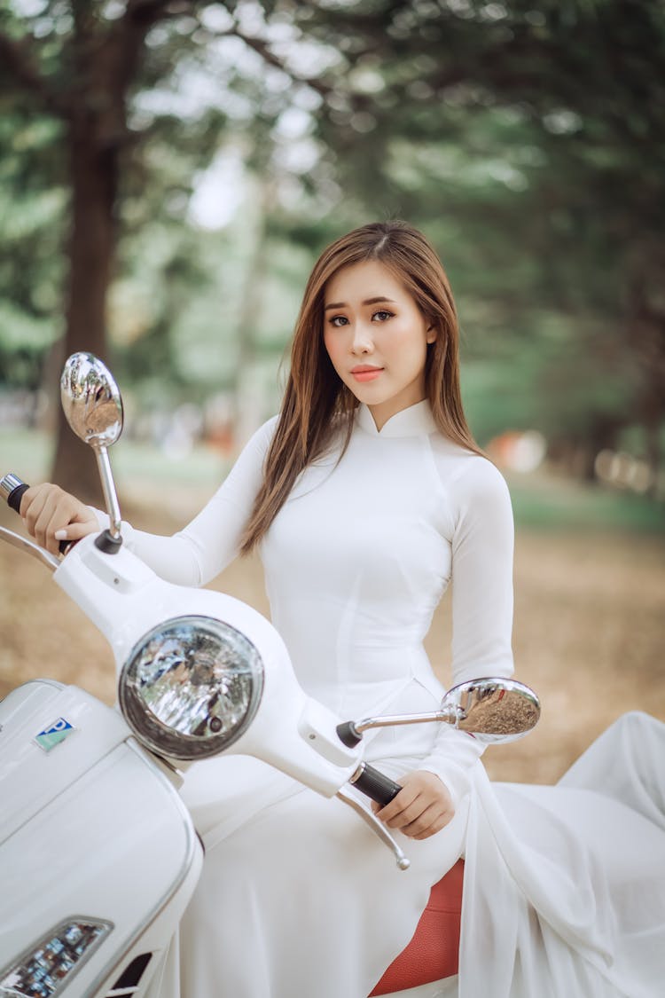 Woman Posing On Scooter