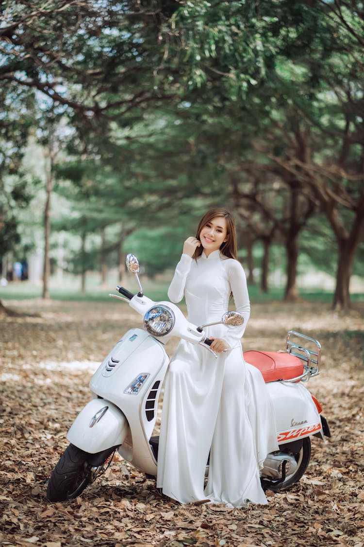 Happy Ethnic Bride On Vintage Scooter