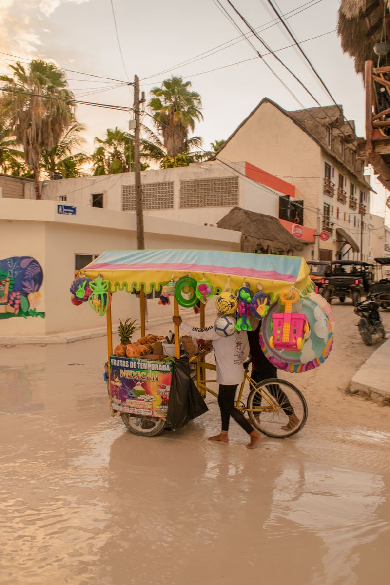 Tropical fruit vendor on a sunny Tulum street