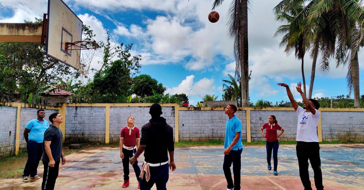 young people playing basketball inside Christ Embassy Loveworld Arena Ho