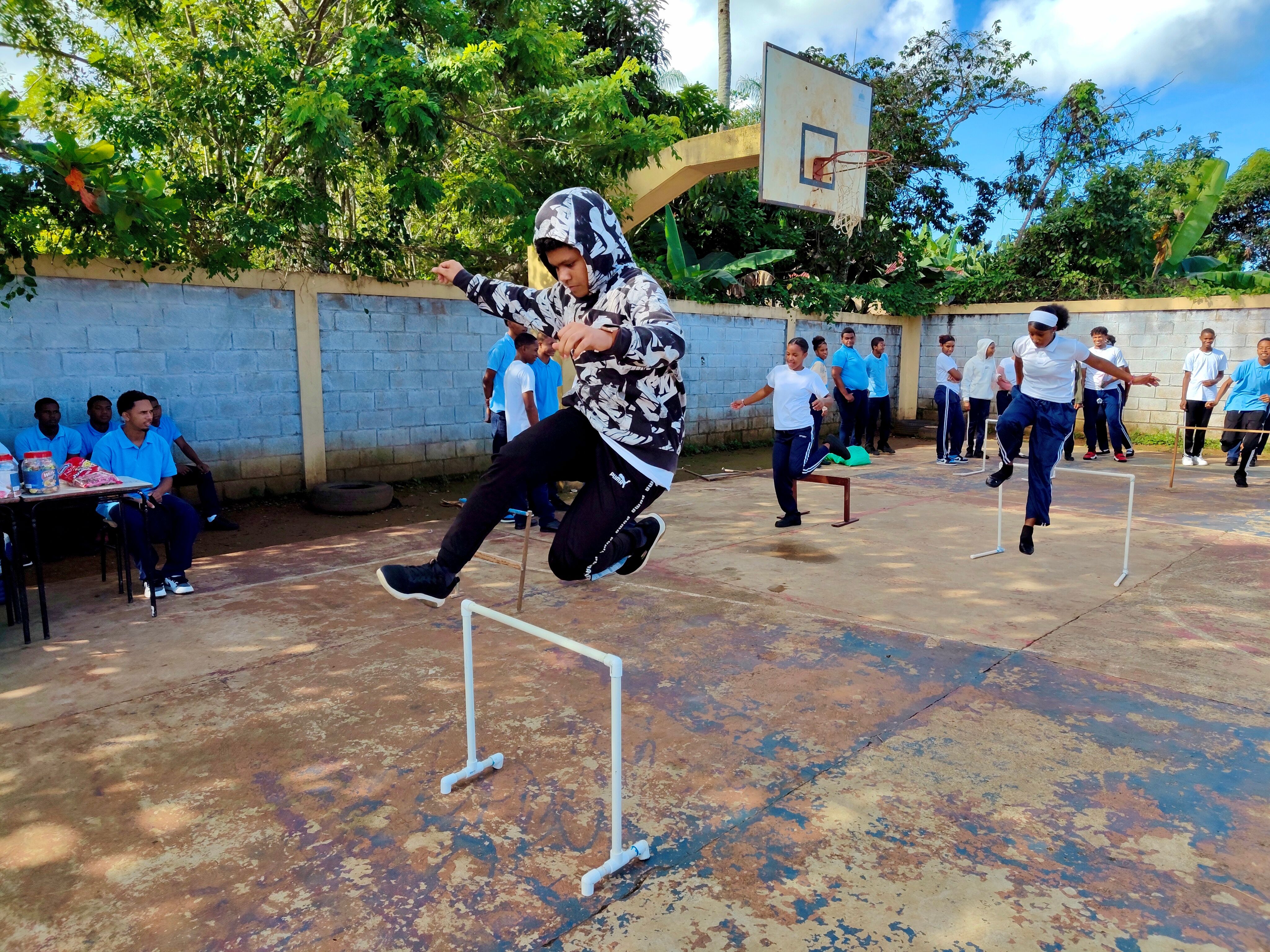 Outdoor School Sports Activity with Students Jumping · Free Stock Photo
