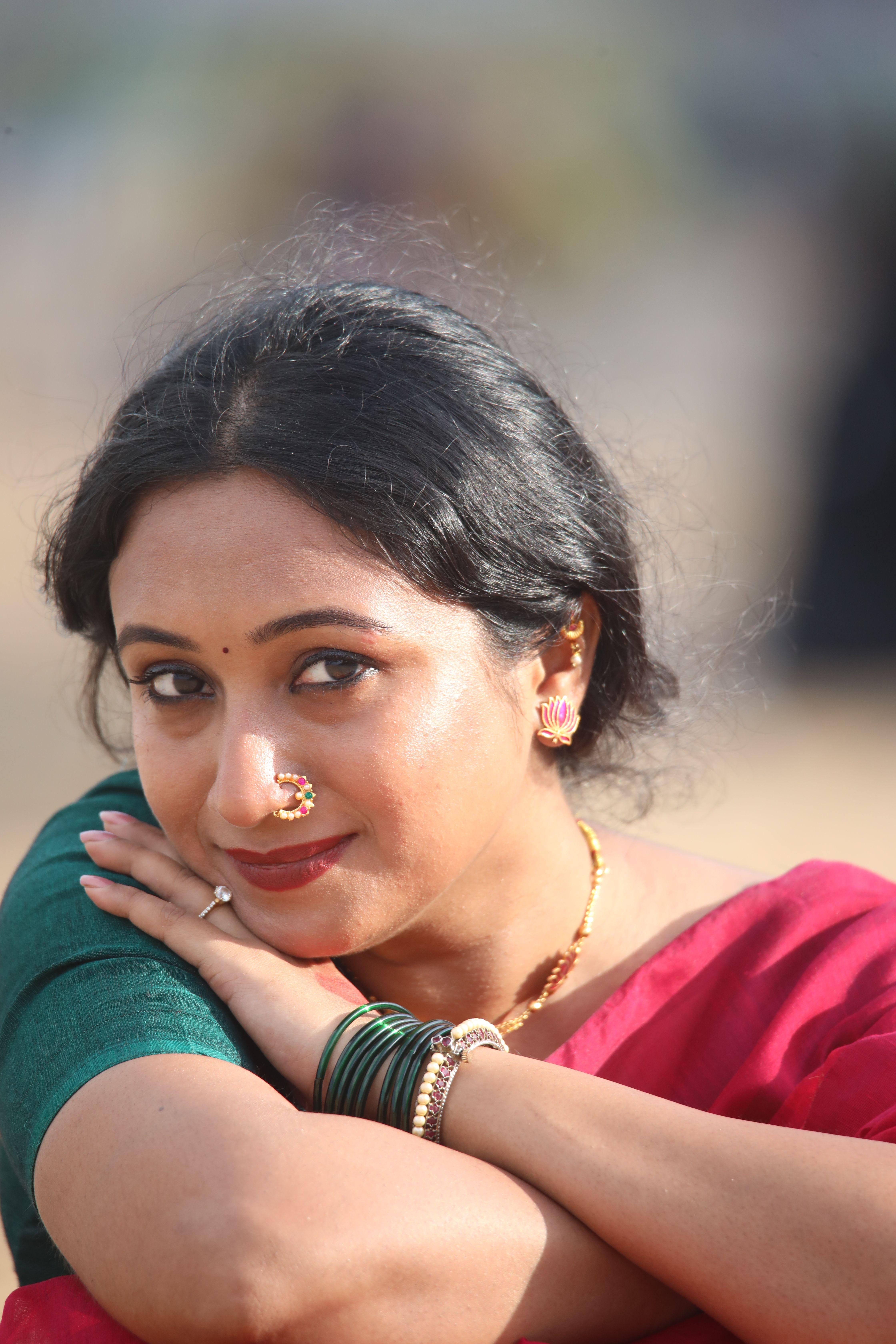 Close-up portrait of a woman in vibrant traditional wear, showcasing cultural elegance.
