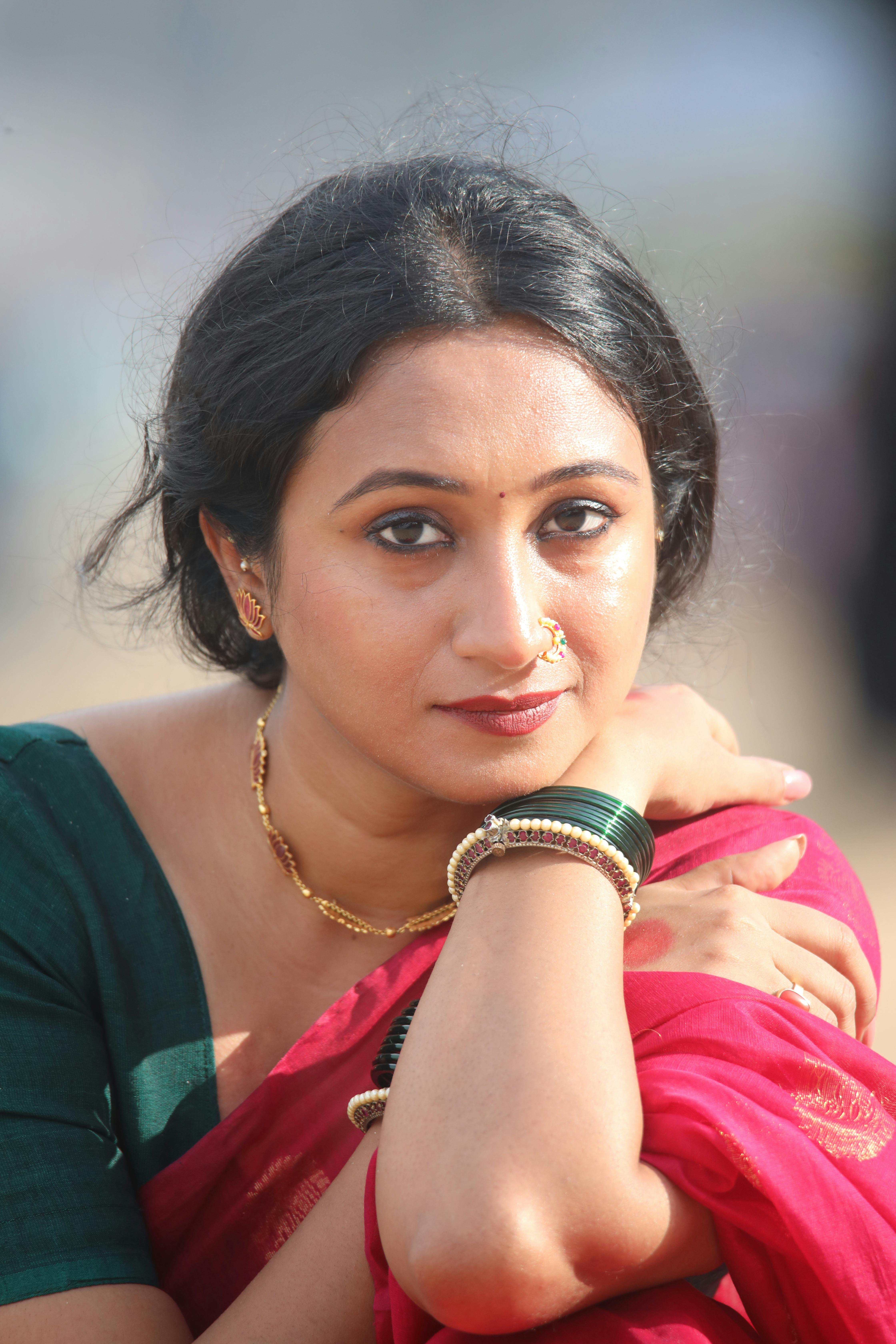 Close-up portrait of a woman in traditional Indian dress, showcasing cultural beauty and elegance.
