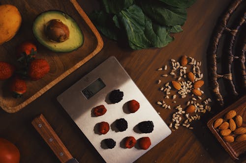 Scales with berries and organic ingredients for recipe