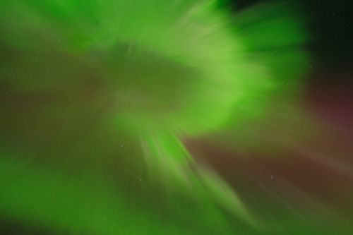 Free Stunning green aurora borealis illuminating the night sky in Tromsø, Norway. Stock Photo