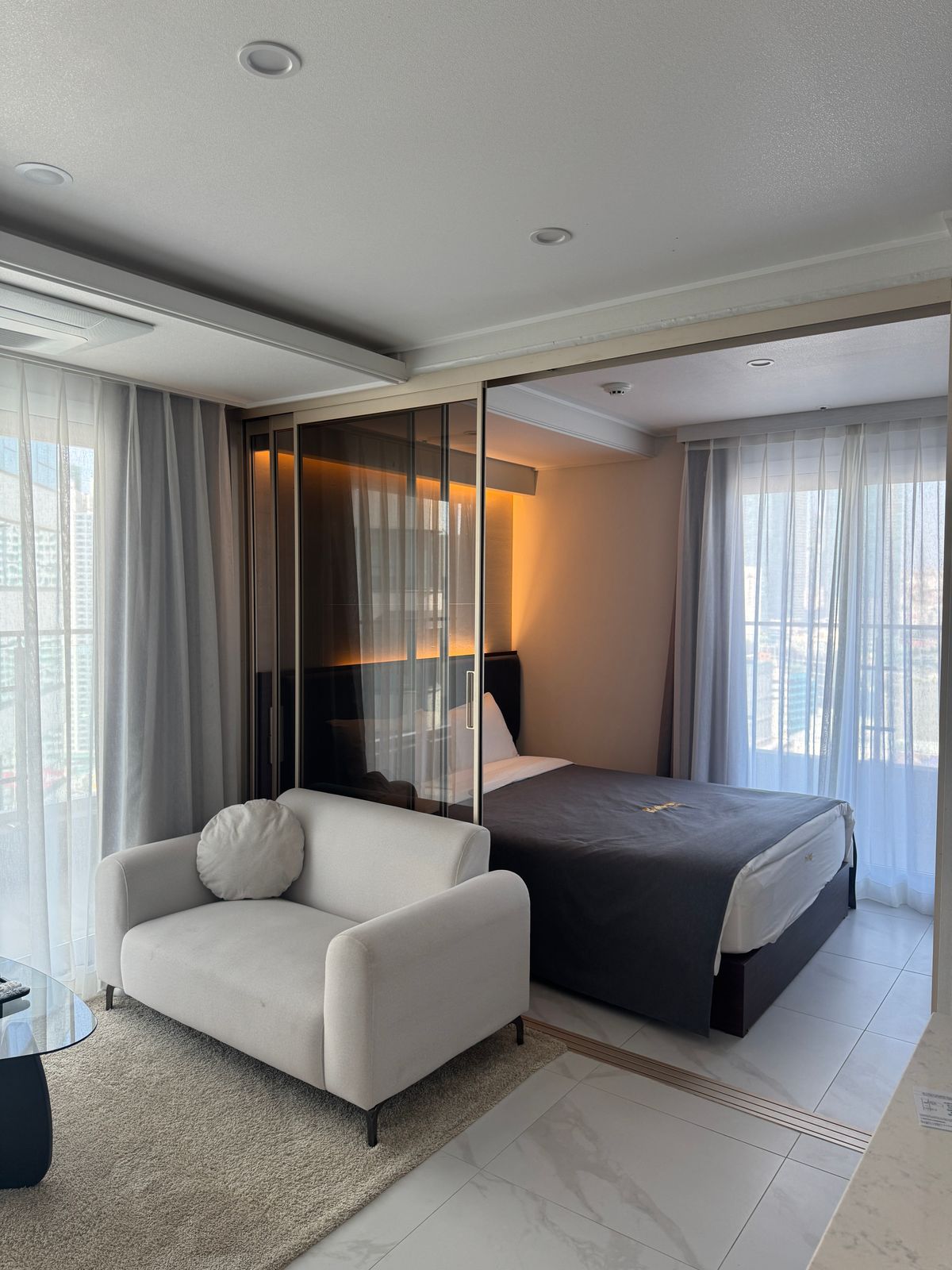 Spacious modern hotel room with a city view