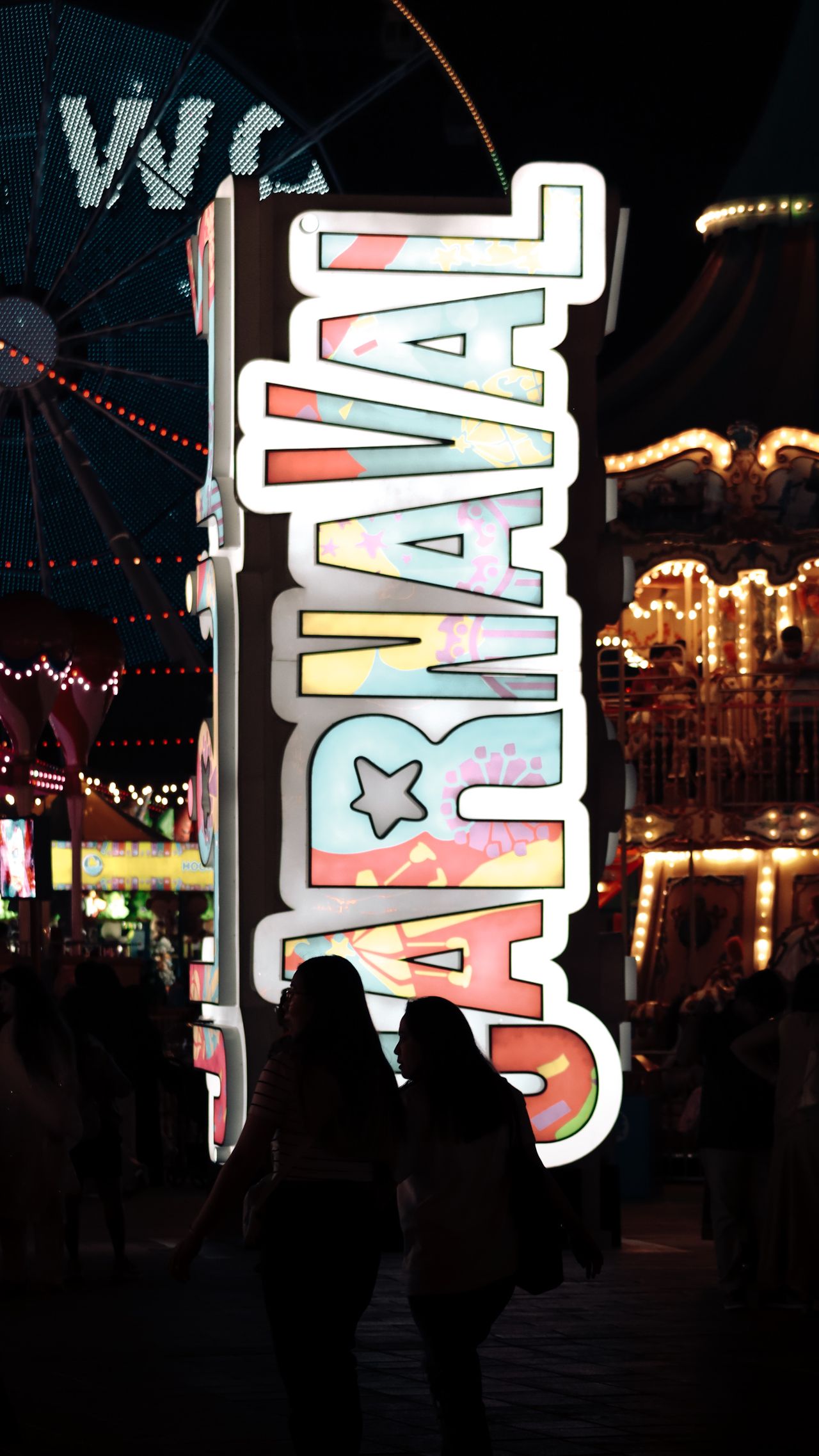 The lit-up Carnaval sign at Global Village at night