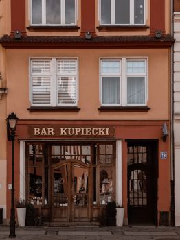 A rustic facade of Bar Kupiecki in Lower Silesian Voivodeship, Poland. Classic architectural style.