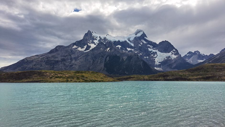 Scenic view of the Andes mountains and turquoise waters in Torres del Paine, Chile.