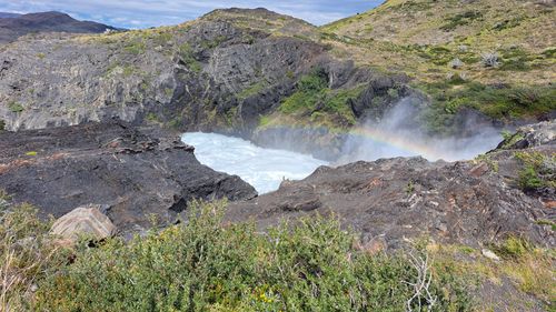Free Vibrant waterfall with a rainbow in Magalhães, Chilean wilderness. Stock Photo