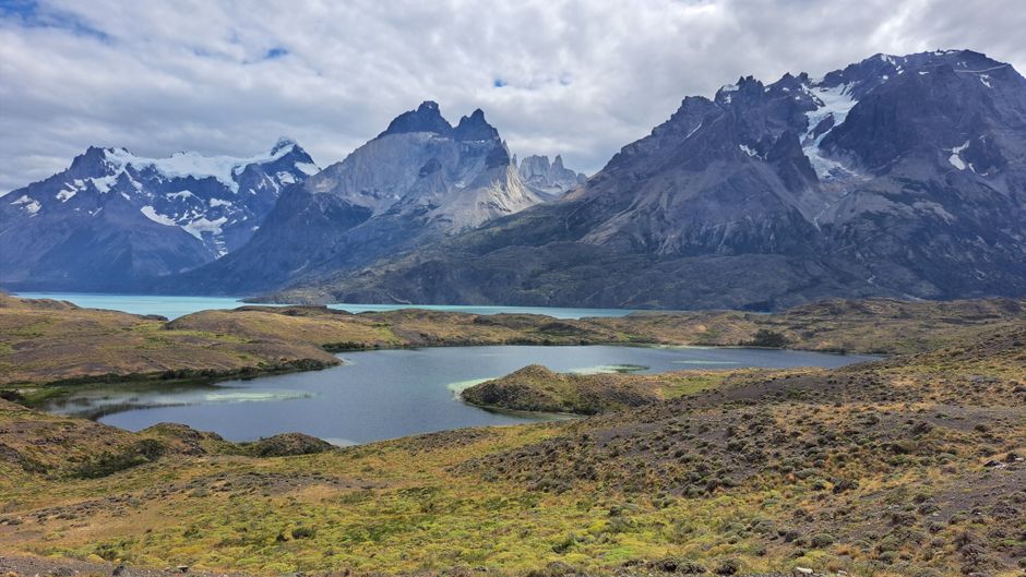 Breathtaking view of mountains and lakes in Torres del Paine, Chile, showcasing natural beauty.