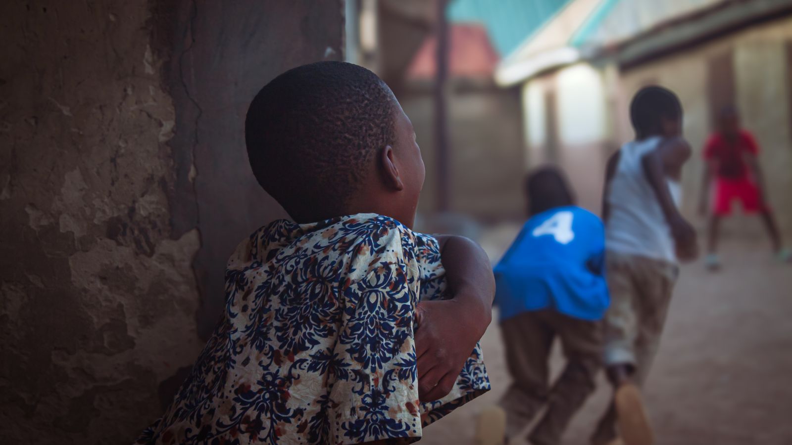 Joyful children playing in a vibrant courtyard in Nigeria