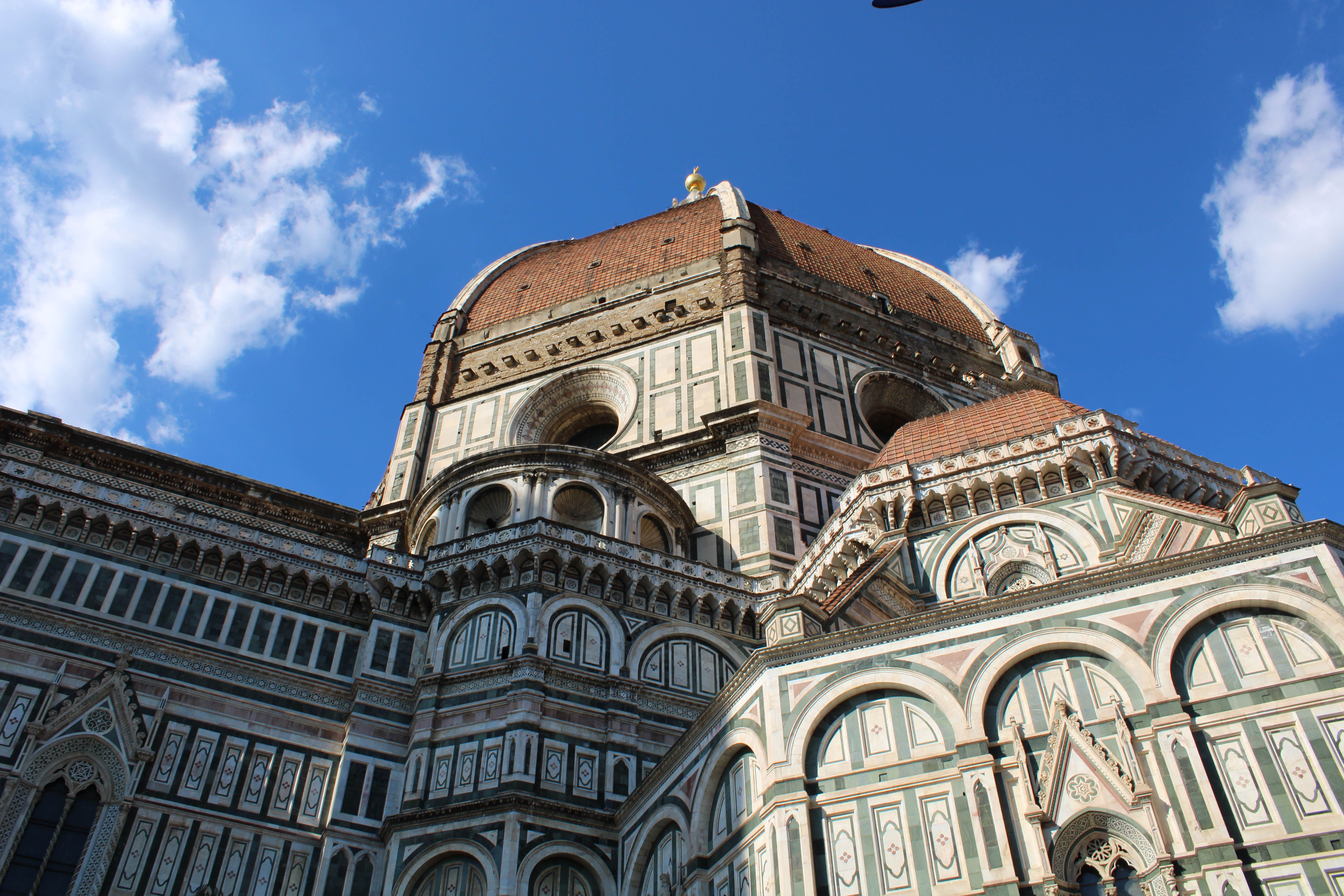 Capture of Florence Cathedral's dome showcasing Italian architecture against a clear blue sky.