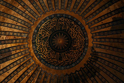 Free Close-up of the ornate dome ceiling in Hagia Sophia, Istanbul, showcasing Islamic calligraphy and architectural beauty. Stock Photo