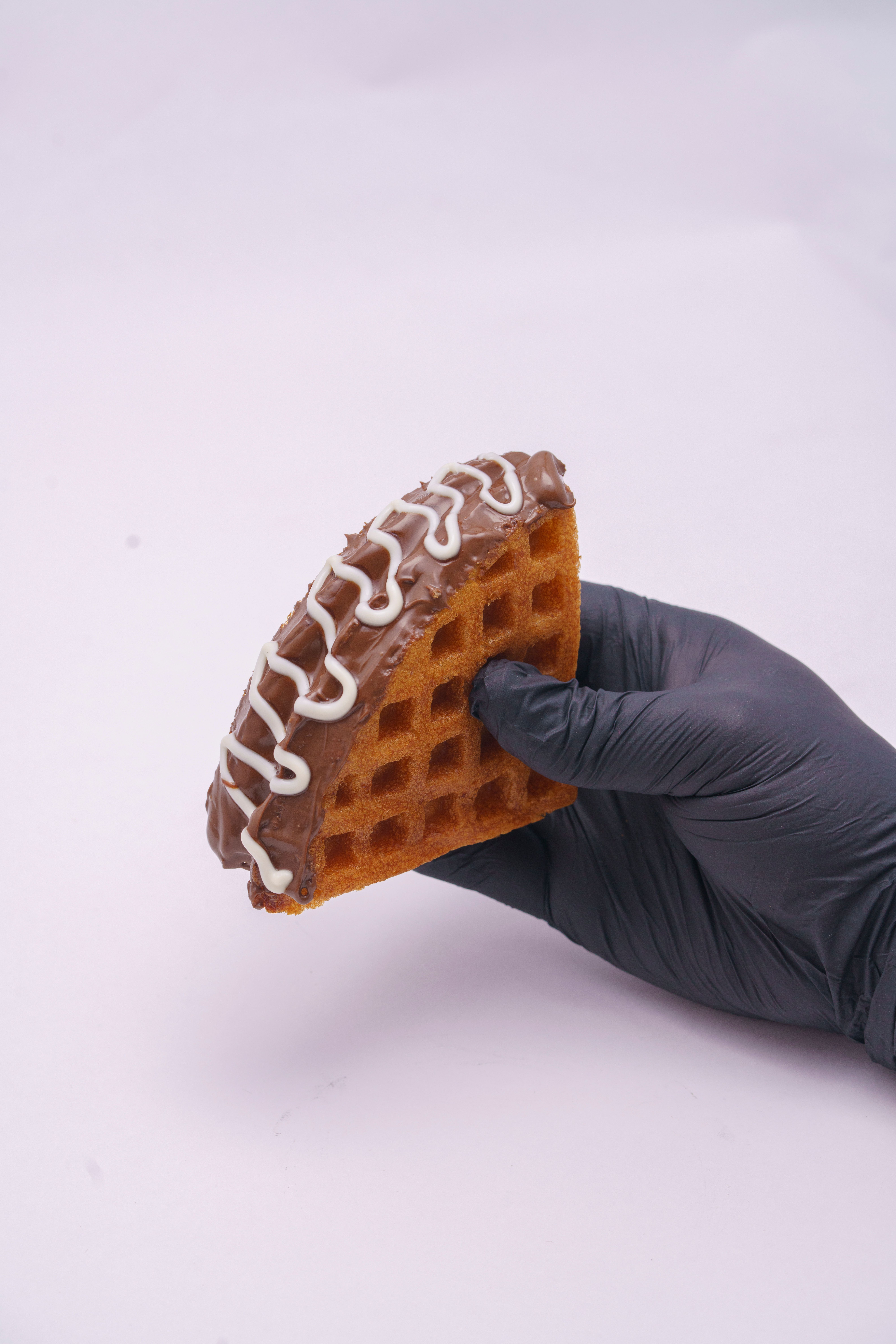 Hand Holding Chocolate Drizzled Waffle on White Background · Free Stock ...