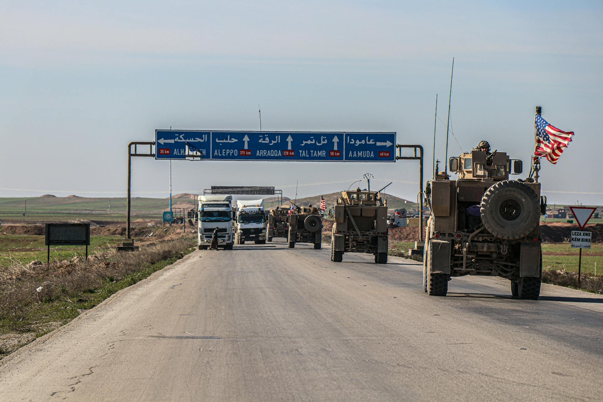 Moving Vehicles on the Road Under Blue Sky