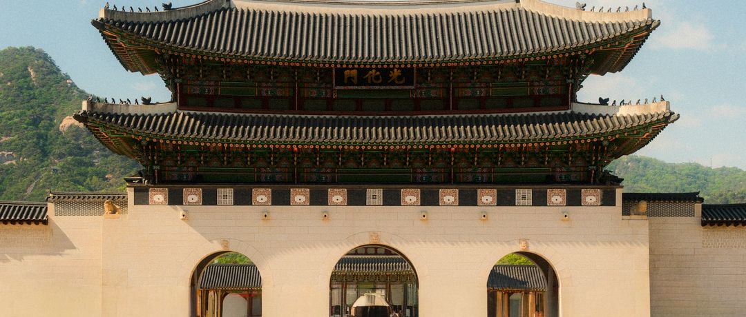 Gwanghwamun Gate, the main entrance of Gyeongbokgung Palace, under a clear daytime sky., travel destination in South Korea, where a local eSIM keeps you connected