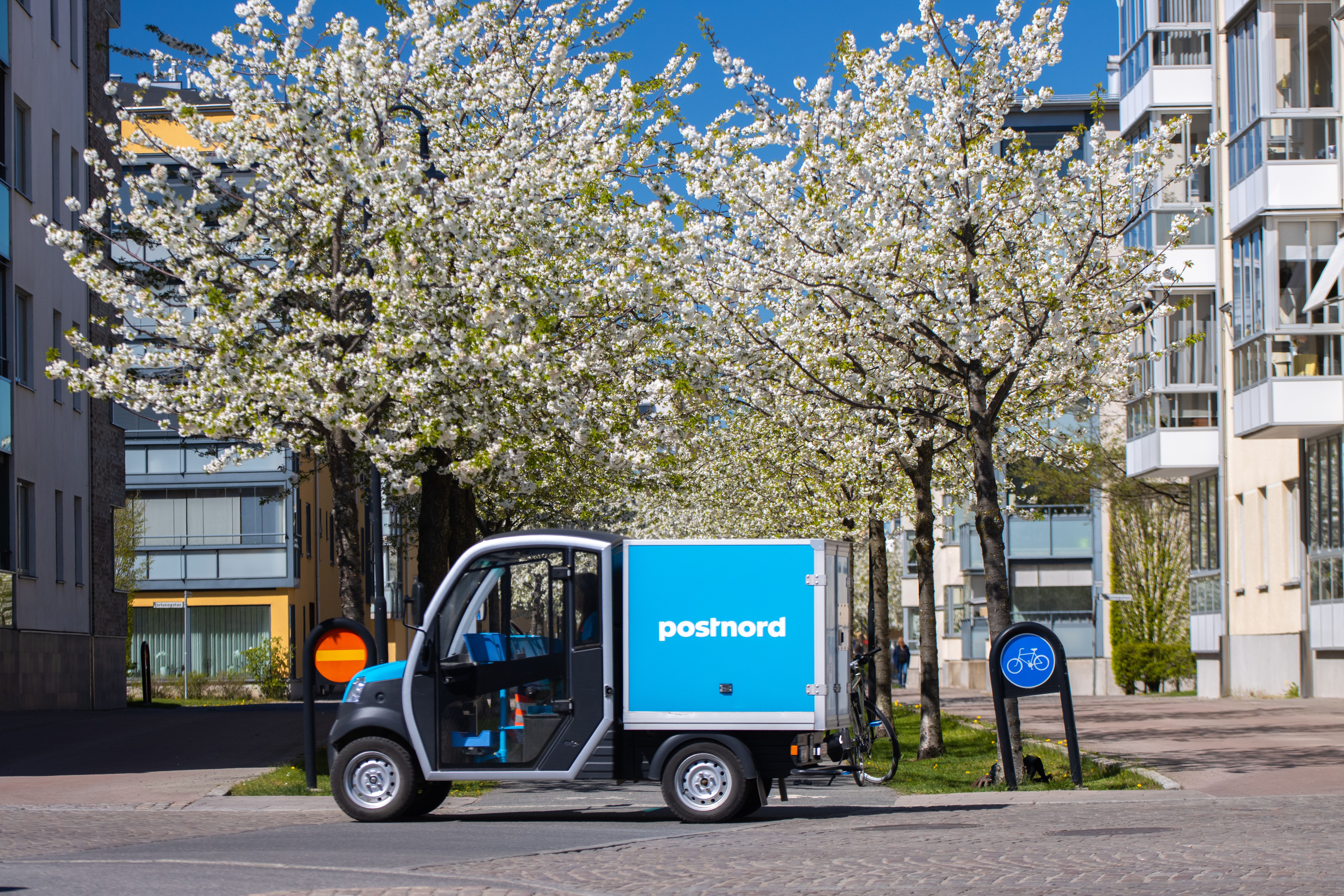 Electric delivery vehicle parked on a city street — commercial Chinese electric mini trucks for urban last-mile logistics