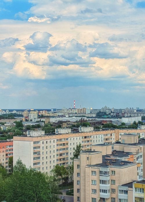 Free Scenic view of Minsk cityscape with residential buildings and cloudy sky, captured from an elevated perspective. Stock Photo