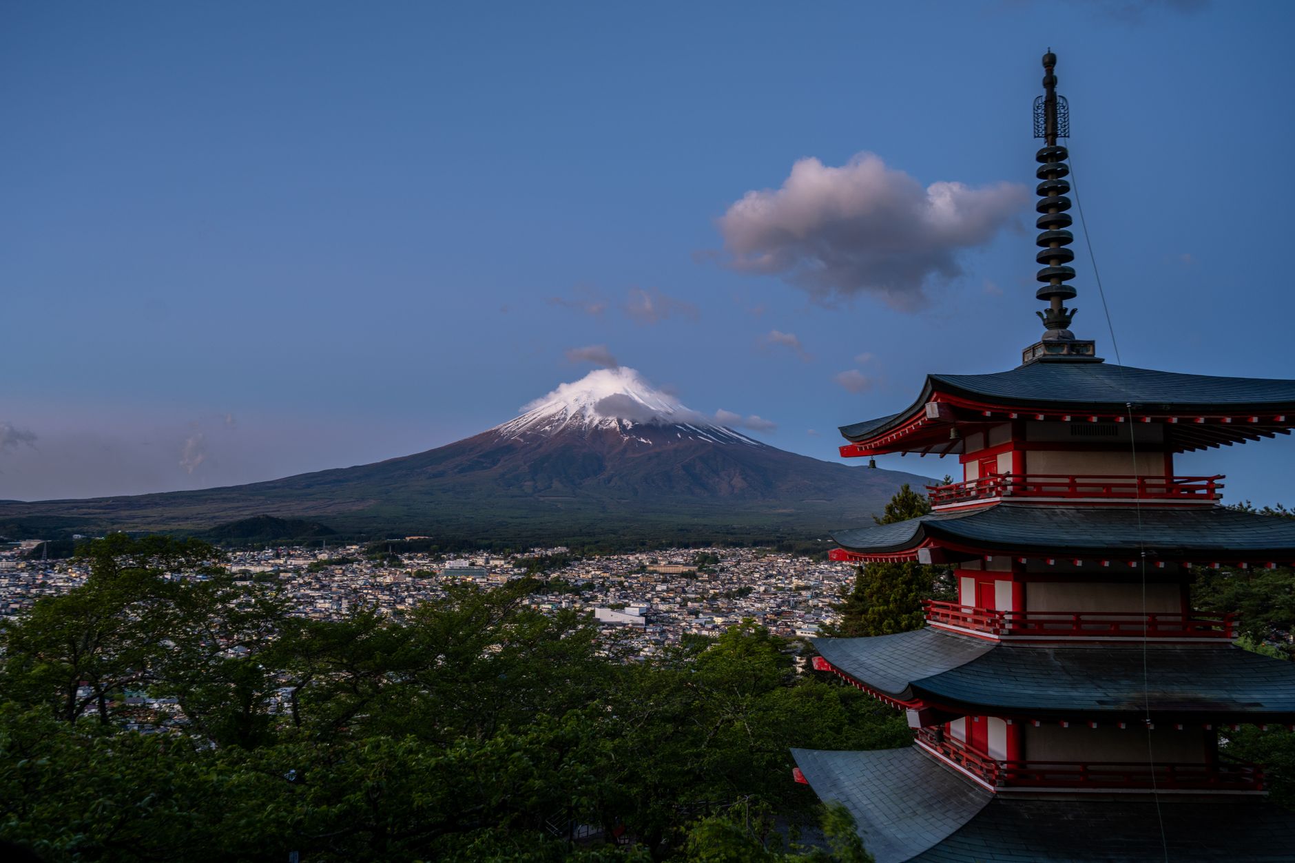 Scenic view of Mount Fuji with Chureito Pagoda, capturing Japan's iconic landscape during twilight.