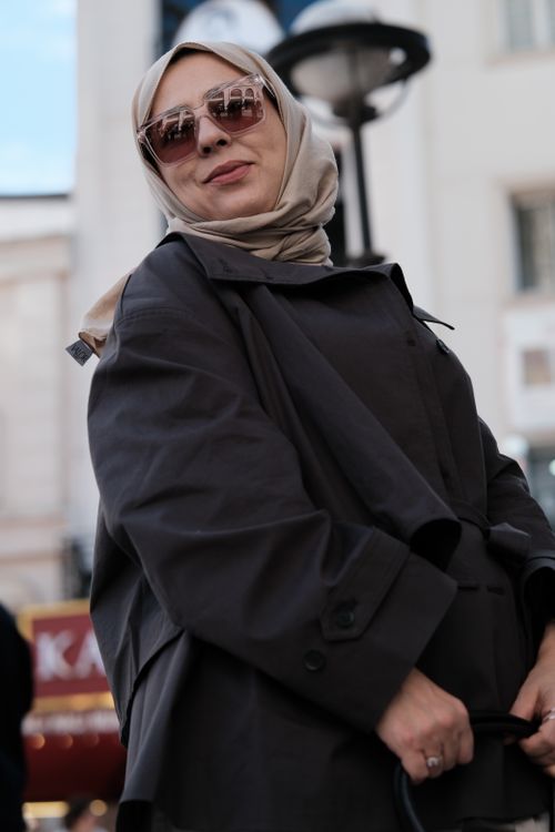 Free Woman in hijab and sunglasses in an urban environment, exuding style and confidence. Stock Photo