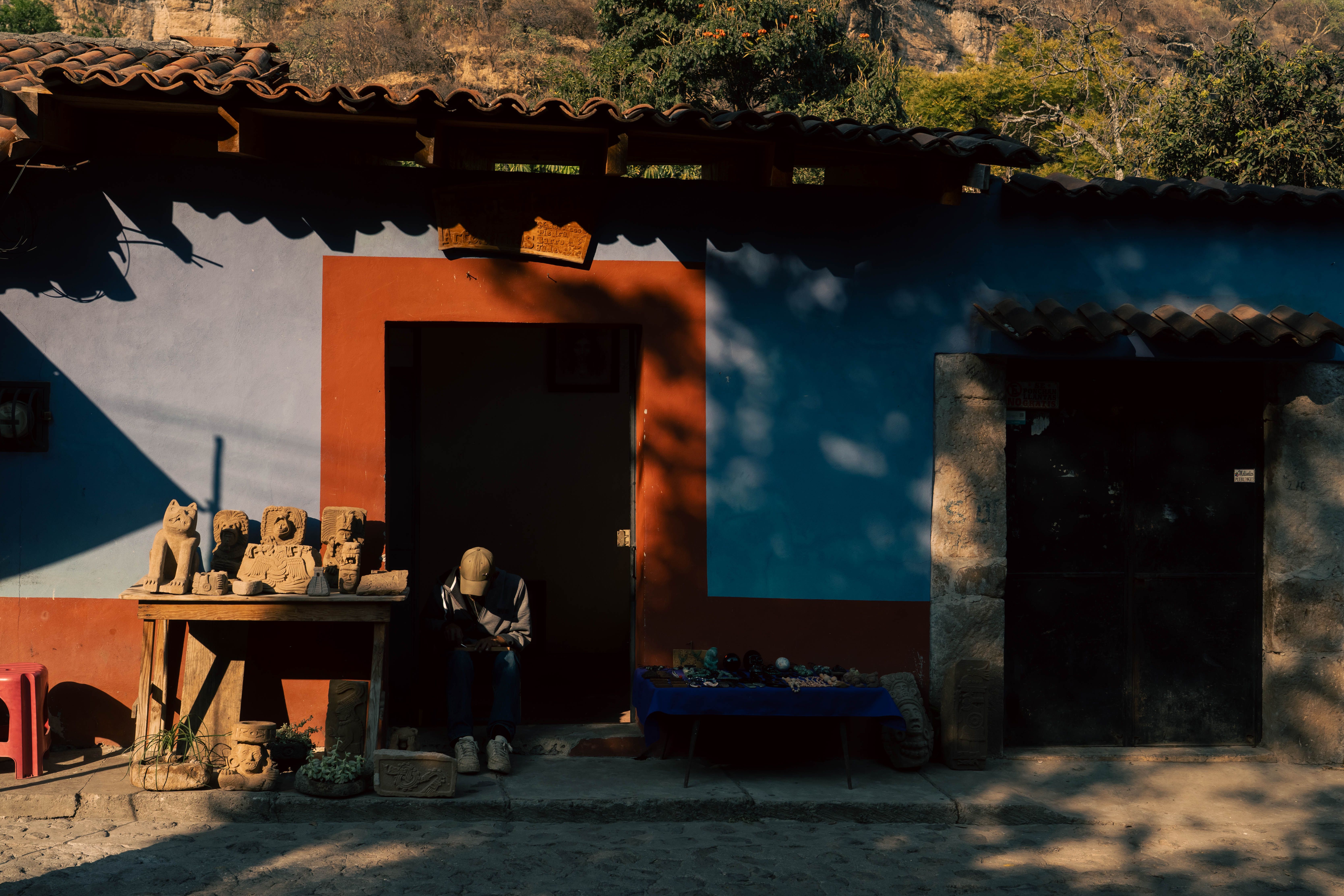Adobe houses with clay tile roofs on a cobbled street in a small southern La Paz town