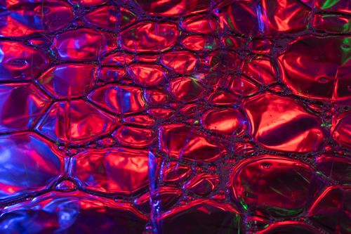 Free Colorful abstract close-up with multicolored lights creating vibrant patterns and reflections. Stock Photo