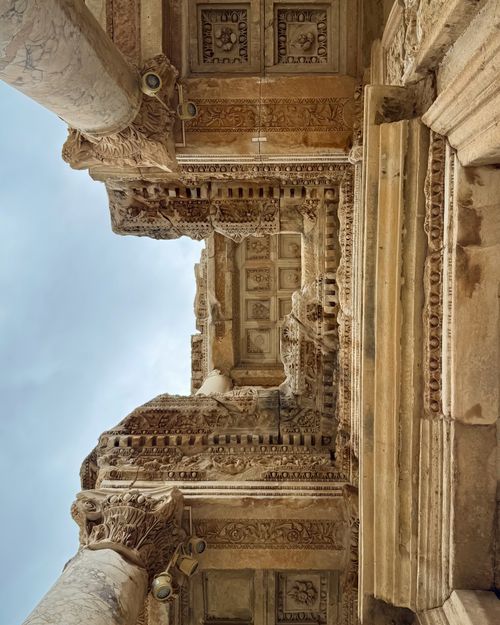 Free Looking up at the ornate carvings on the Celsus Library in İzmir, Türkiye. Captures ancient Roman architecture. Stock Photo