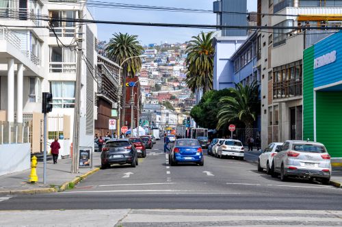 Free A vibrant street scene in Valparaíso, Chile featuring colorful buildings and city life. Stock Photo