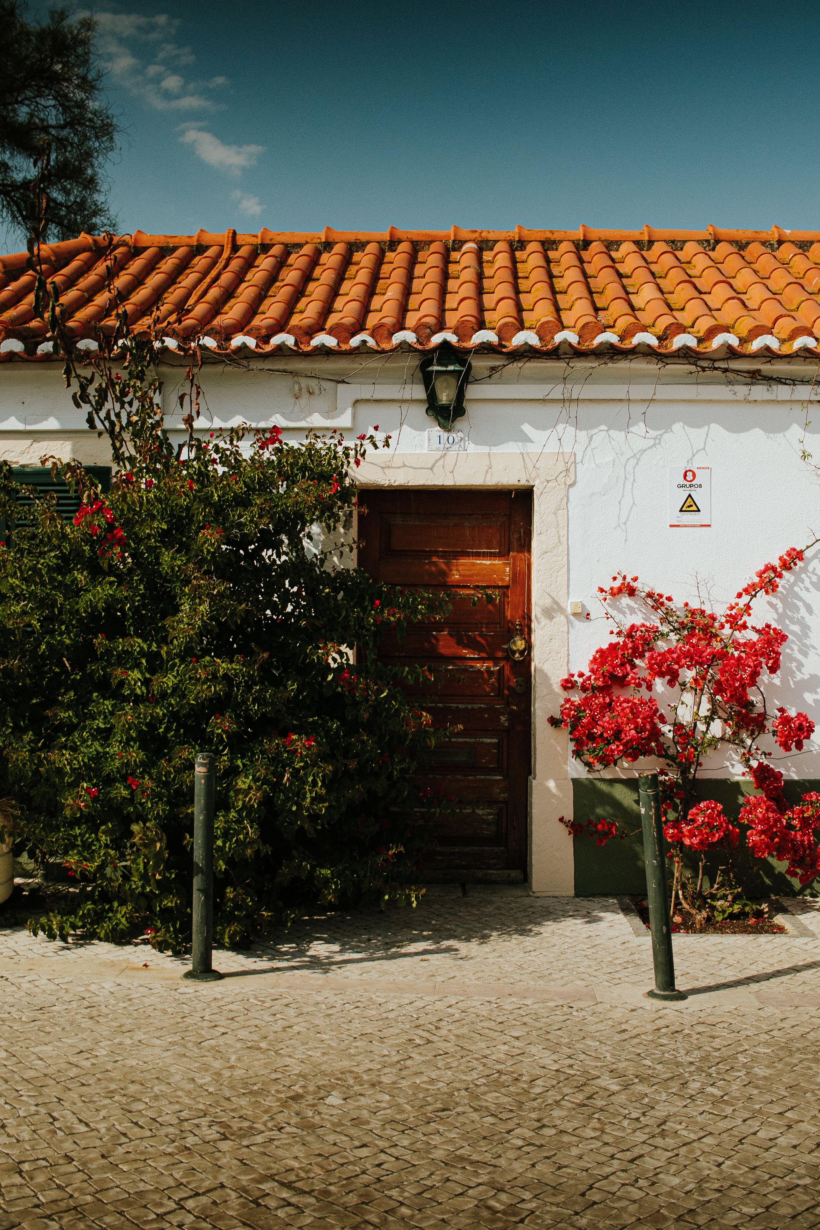 Close-up of Marvão house built into a granite boulder with a wooden door