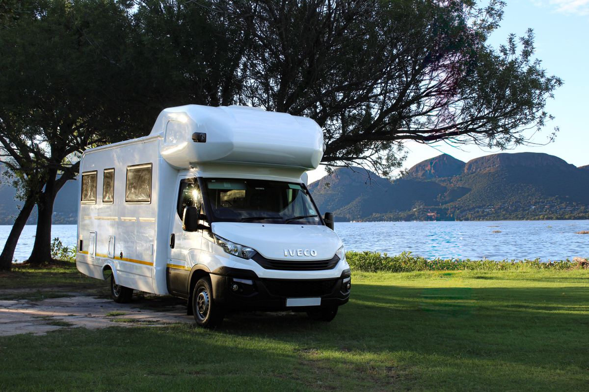 Class C Family Cruiser by a mountain lake