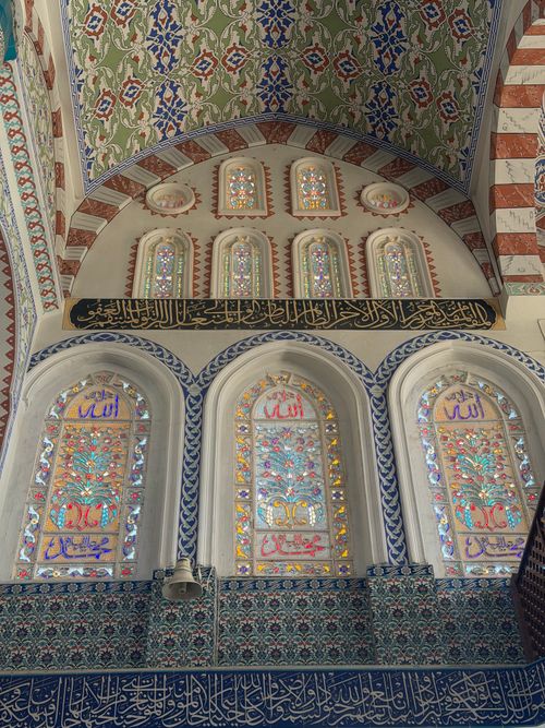 Free Colorful stained glass windows and ornate interior design in a Diyarbakır mosque, reflecting Islamic artistry. Stock Photo