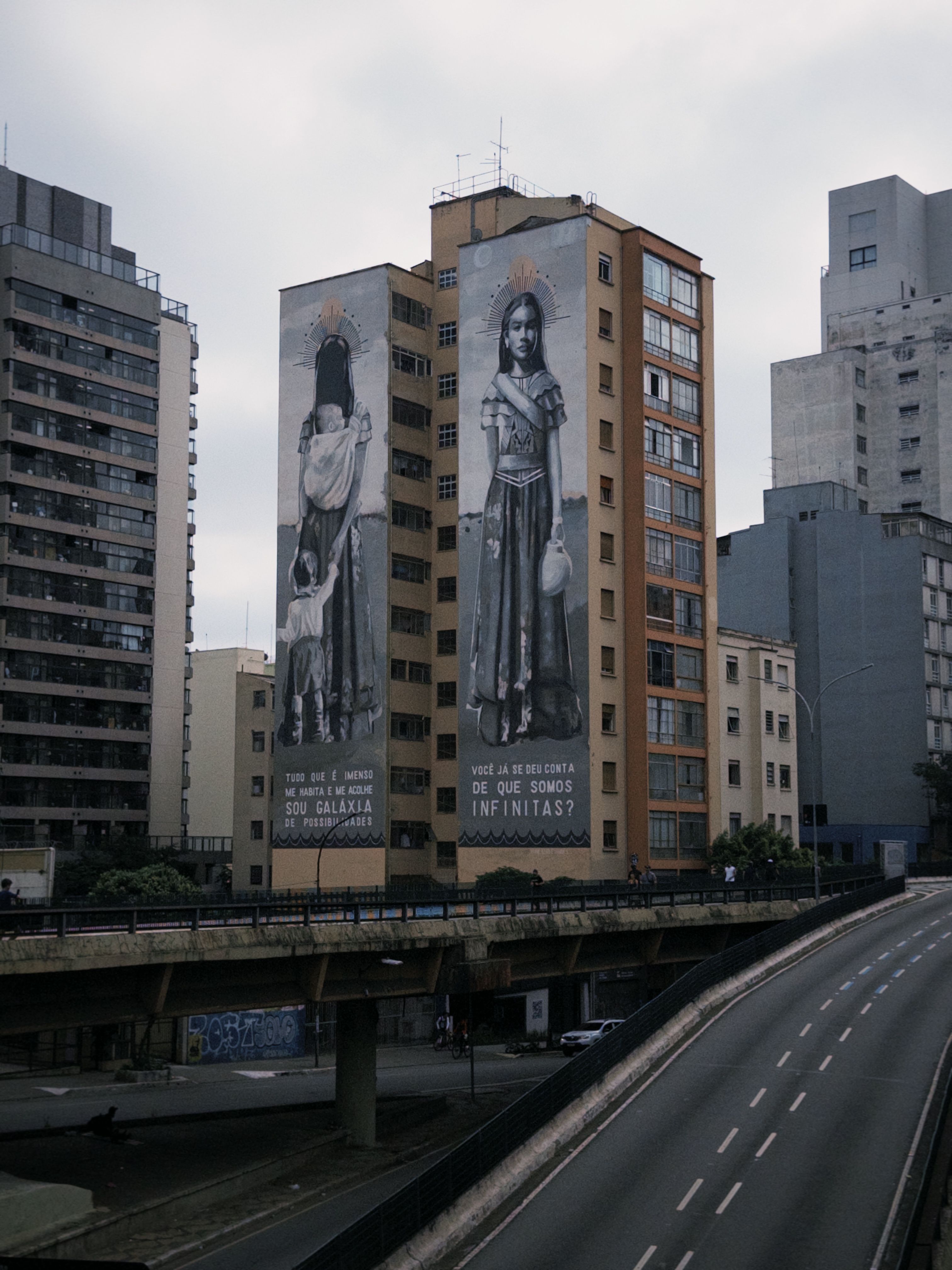 Dramatic street art murals on city buildings in São Paulo, capturing cultural expressions.