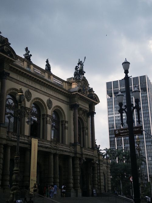 Free View of the historic Teatro Municipal in São Paulo with dramatic architecture and surrounding cityscape. Stock Photo