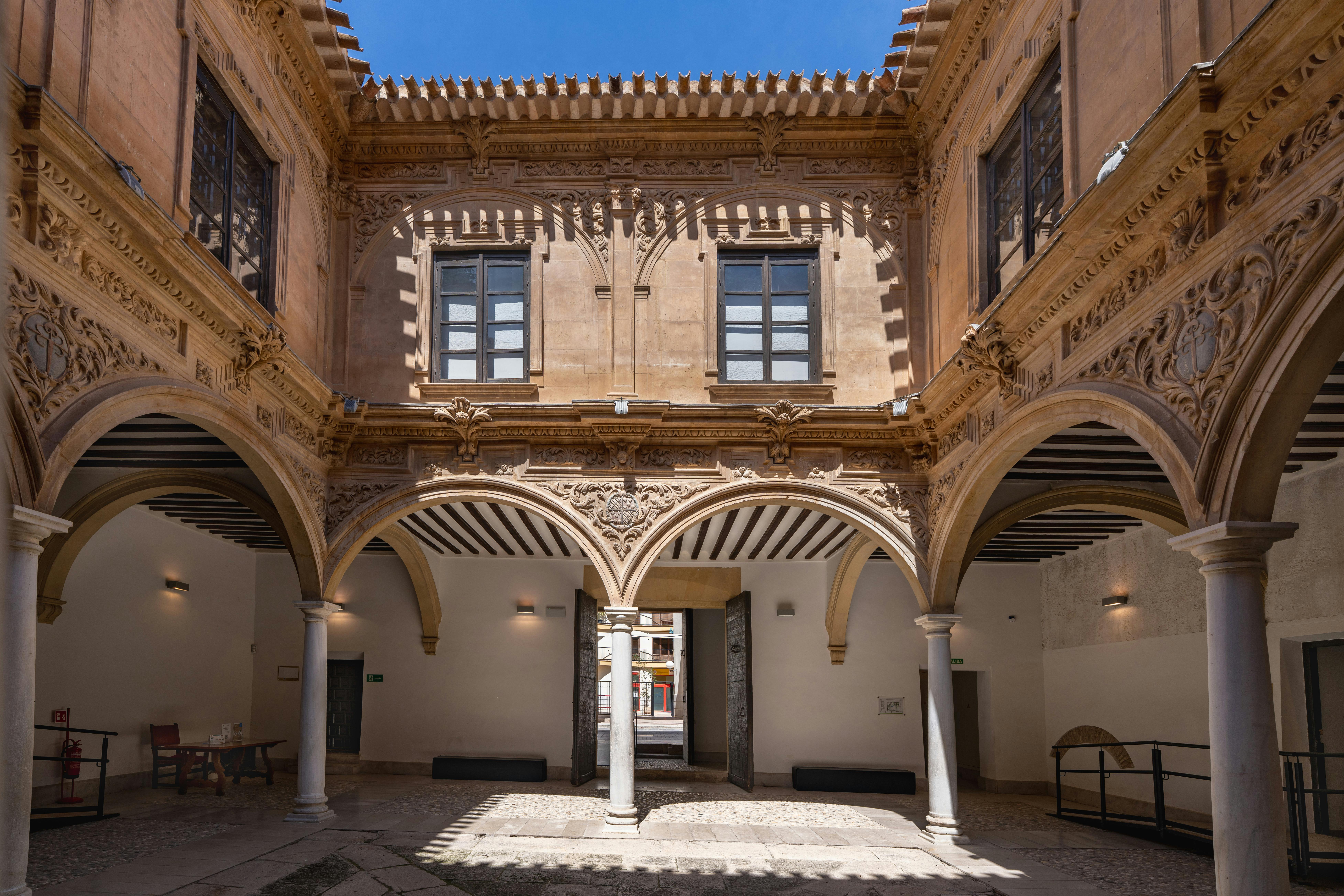 Beautiful Renaissance courtyard in Lorca, showcasing intricate architecture and bright summer lighting.
