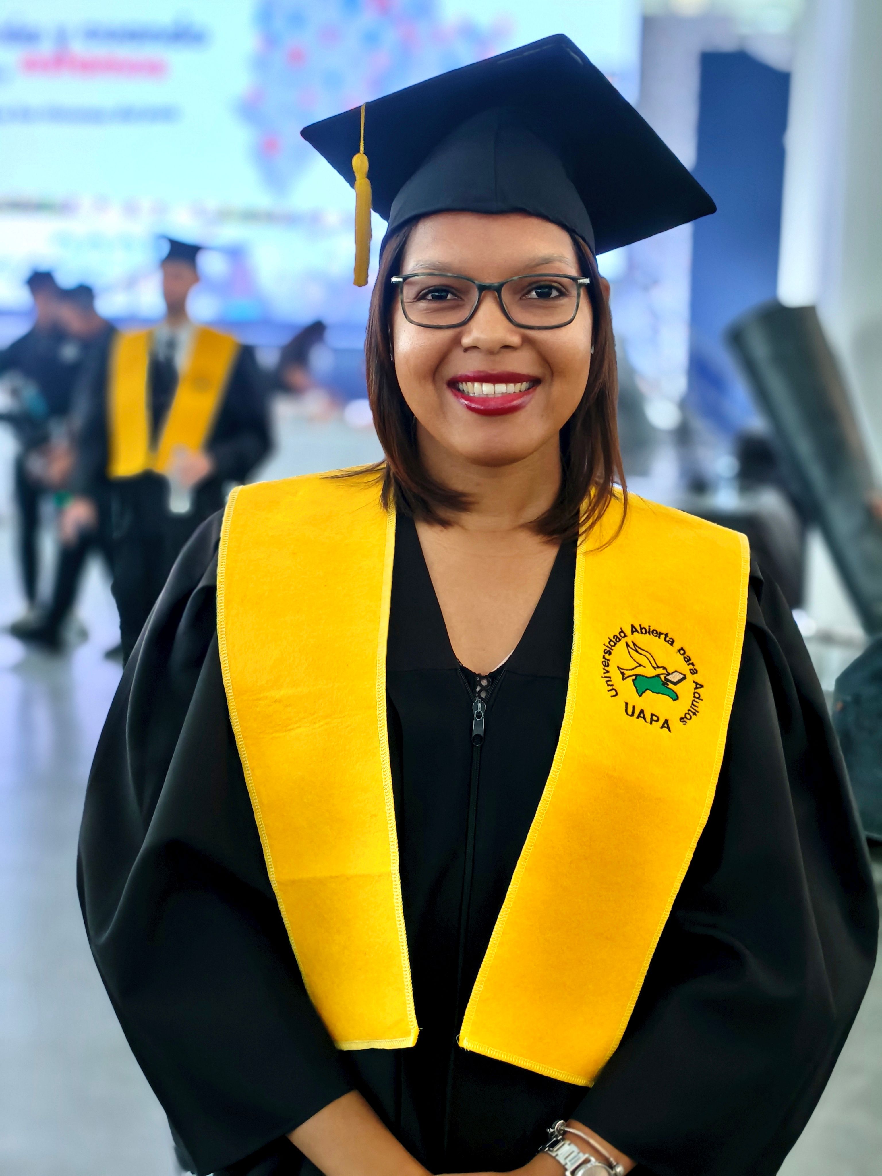Smiling Graduate at University Ceremony · Free Stock Photo