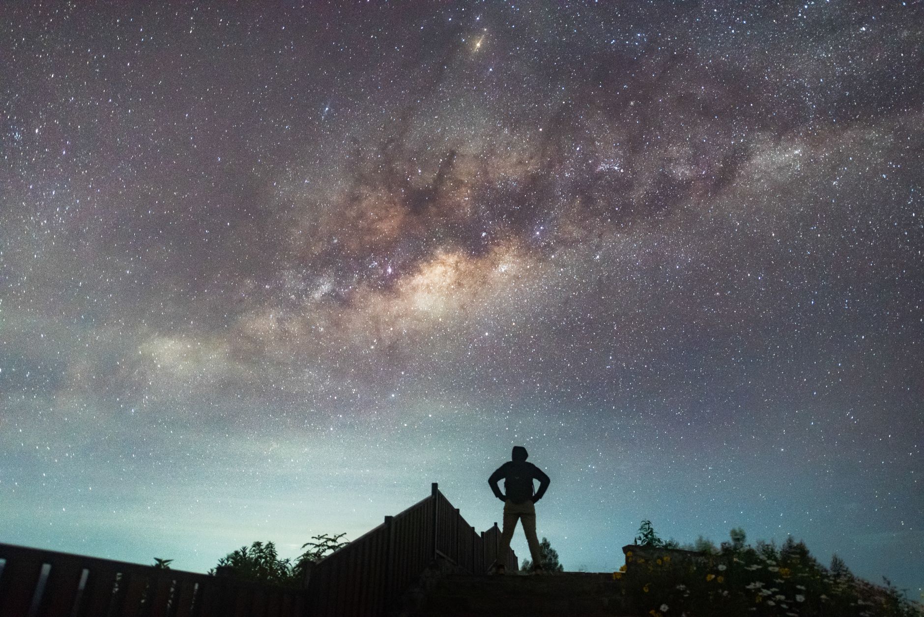 Silhouette of a person under the Milky Way galaxy in East Java, Indonesia.