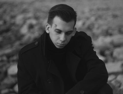 Grayscale Photo Of Man In Black Coat