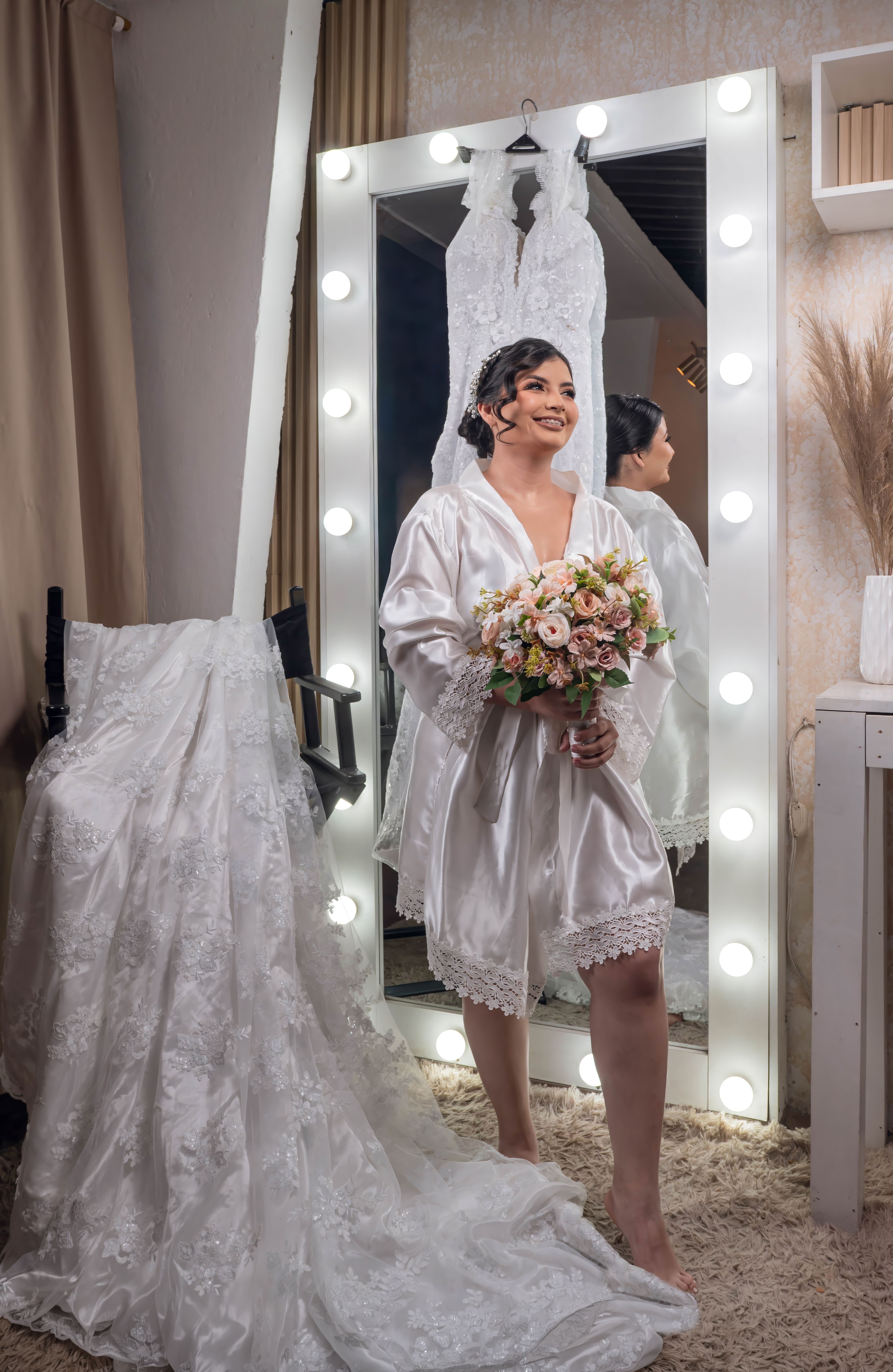 Bride in dressing gown with bouquet before wedding ceremony, Santo Domingo, Ecuador.
